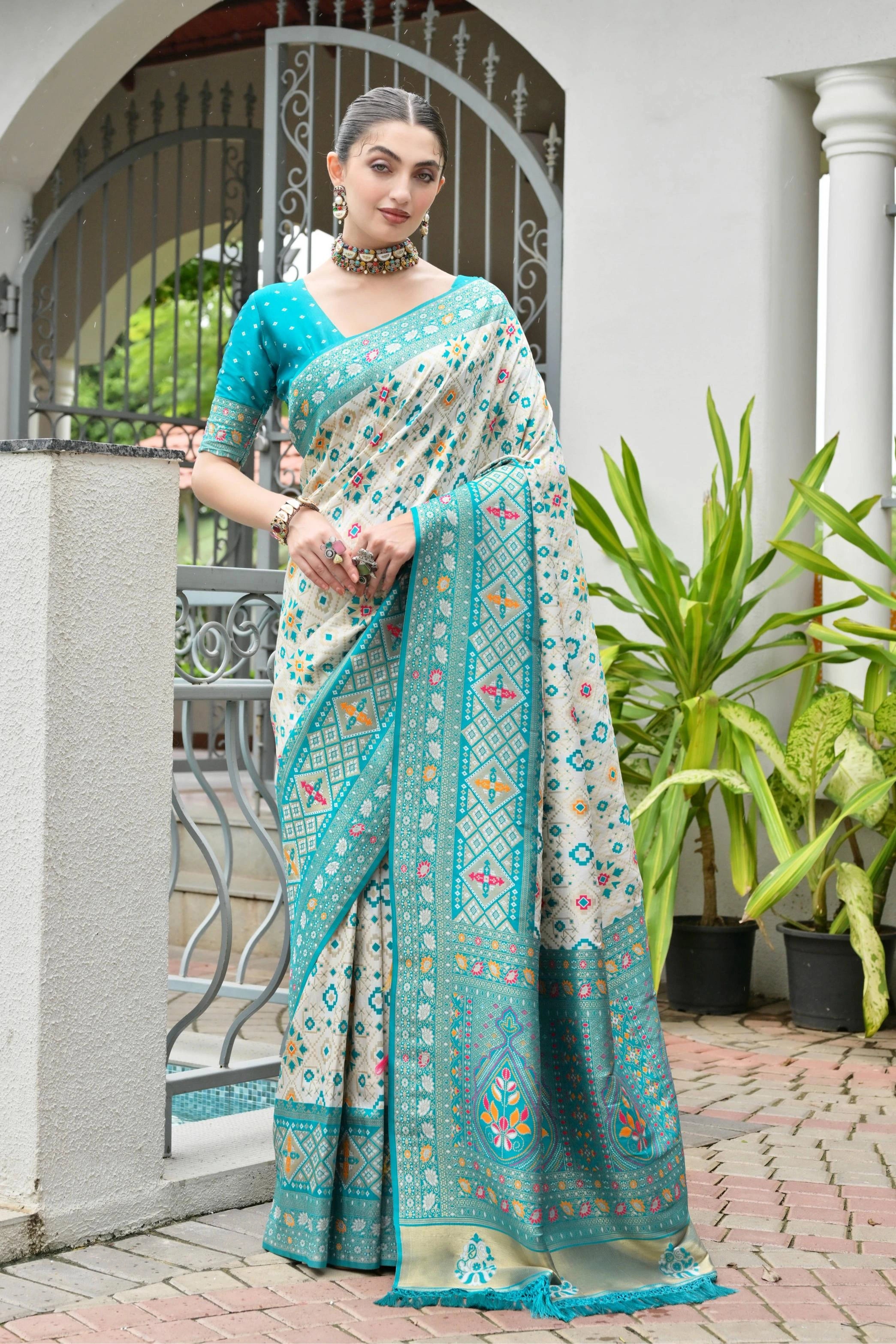 Traditional Banarasi silk saree in sky blue with ornate zari patterns draped gracefully.